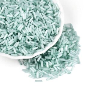 6mm Glass Bugle Beads - Teal. These tubular beads have a hole passing through the length of the bead and are a shade of pastel.