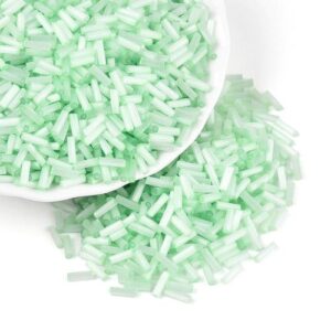 6mm Glass Bugle Beads - Peppermint. These tubular beads have a hole passing through the length of the bead and are a shade of pastel.